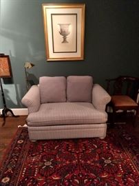 One of a pair of Sealy Furniture love seat/sleepers in mattress ticking fabric.