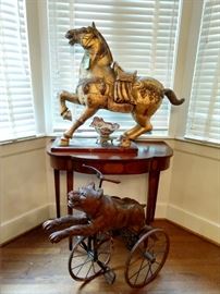 OOOOOOH!!!                                                                                 Scary wild Asian horses and German bear tricycle have joined forces in the dining room to attack anyone who doesn't eat their meat! The hand carved, gilt wood Asian horse is actually quite wonderful - and BIG!