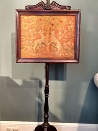 Antique embroidered English mahogany summer fire screen.