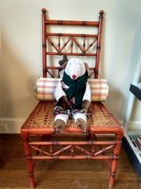 Fun vintage faux bamboo chair, with stuffed reindeer and lumbar pillow for support during that long ride form the North Pole.