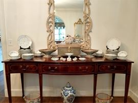 Federal style Trosby serpentine sideboard, executed in mahogany with satinwood inlay, having a serpentine top above a wide apron with three cock beaded drawers having string inlay outlining the fronts, the whole rising on square tapering legs ending in spade feet;      
measures 36.5" h x 78"w x 24"d.