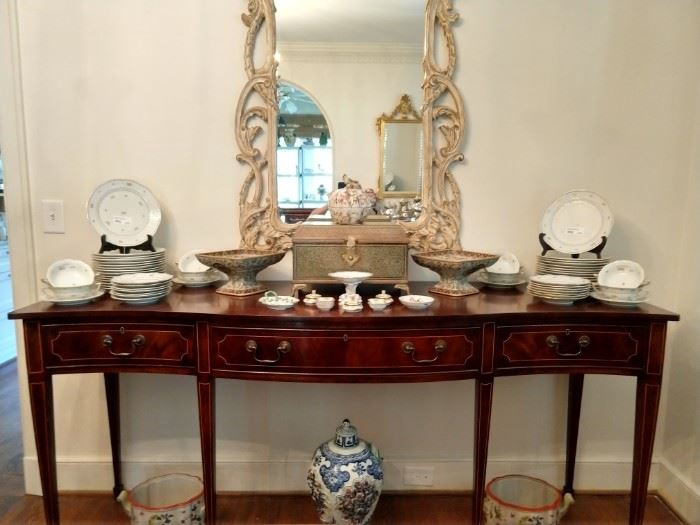 Federal style Trosby serpentine sideboard, executed in mahogany with satinwood inlay, having a serpentine top above a wide apron with three cock beaded drawers having string inlay outlining the fronts, the whole rising on square tapering legs ending in spade feet;      
measures 36.5" h x 78"w x 24"d.