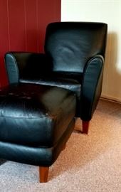 black leather arm chair and ottoman