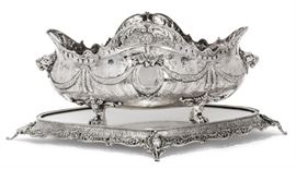 Lot 1 A sterling silver jardinière on mirrored plateau  
The jardinière marked Sterling, the stand marked A 925, modern 
In the German 'Historismus' style  