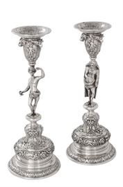 Lot 2 A pair of German 800 standard silver figural candlesticks  
With pseudo marks, probably Hanau, early 20th century 
Depicting an old man and a young man  
