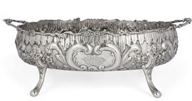 Lot 4 A large German silver oval footed two-handled center bowl  
With unidentified pseudo marks, Hanau; with import marks from Birmingham, 1912 
Engraved with a coat-of-arms  
