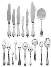 Lot 13 An assembled Danish hammered sterling silver Modernist part flatware service  
By Georg Jensen, Copenhagen, post 1945 
Continental (Antik) pattern, comprising: 7 dinner forks, 11 dinner knives, 11 luncheon forks, 1 luncheon knife, 11 fish forks, 12 breakfast knives, 5 round bowl soup spoons, 6 oval bowl soup/dessert spoons, 10 butter spreaders, 10 cocktail forks, 12 teaspoons, 7 iced teaspoons, 2 table spoons, 4 serving pieces, most monogram: CTS (109)  