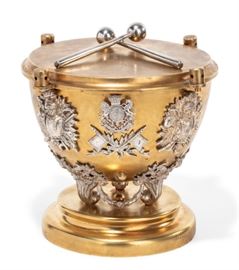 Lot 21 A Victorian parcel gilt silverplate drum form box  
By Howell James & Co., London, late 19th century 
Kite registration mark for 16 January 1873, with blue satin lined interior, gilt monogram I.I  
