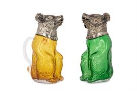 Lot 22 A matched pair of Victorian electroplate-mounted colored glass bear-form decanters  
By various makers, late 19th century 