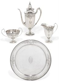 Lot 23 An American sterling silver four-piece black coffee service  
By Redlich, New York, NY, early 20th century 
Comprising: a coffee pot, a cream jug a sugar bowl and a circular tray, monogram HLH  