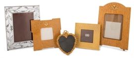 Lot 36 An assembled collection of five metal and wood tabletop picture frames  
By various makers, modern 
Comprising: two burr maple with gilt mounts, one square gilt metal, one heart form and one rectangular pierced with foliate decoration  