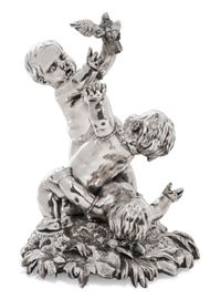 Lot 41 A Continental silvered bronze figural group of putti and a dove  
Apparently unmarked, late 19th century 
Possibly formerly with a base  