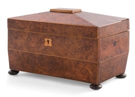 Lot 43 A Regency yew wood tea caddy 
early 19th century 
The interior fitted with two hinged compartments and an open aperture.  