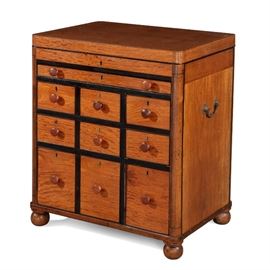 Lot 50 An Anglo-Indian ebonized and satinwood gentleman's writing/dressing chest 
mid 19th century 