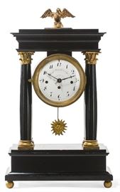 Lot 55 A Continental Neoclassical gilt metal mounted ebonized mantel clock 
possibly Austrian 
early 19th century 
The circular enamel dial inscribed  
Joseph Matuschka in Jylau, with subsidiary calendar dial, the three train movement striking on two gongs.  
