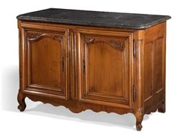 Lot 57 A Louis XV walnut buffet 
mid 18th century 
Surmounted by a dark gray mottled marble top, the interior fitted with two drawers.  