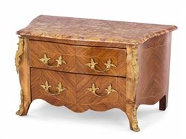 Lot 83 A Louis XV style gilt bronze mounted inlaid walnut miniature commode 
20th century 
Surmounted by a marble top.  