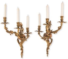 Lot 101 A pair of Louis XV style gilt bronze three light bras de lumière 
attributed to Raingo Frères 
late 19th century 
Each numbered 2013.  