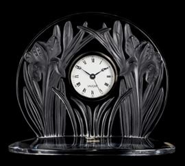 Lot 122 A Lalique frosted and clear glass mantel timepiece: Iris 
late 20th century 
Incised Lalique® France, with factory adhesive label to front.  