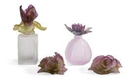 Lot 127 Four Daum pate de verre articles
20th century
Comprising a Physalis perfume bottle; an Iris perfume bottle and pair of Rose candle holders, each incised Daum France. 