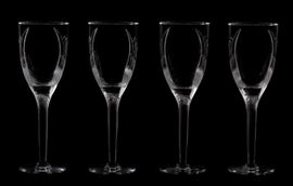 123 A set of four Lalique frosted and clear glass champagne flutes in the Ange pattern  
late 20th century 
Each etched Lalique® France.  