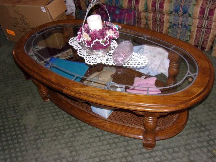 Oval coffee table with glass center. Matching end table.