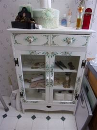 Cute painted cabinet with one drawer and 3 shelves behind glass doors.