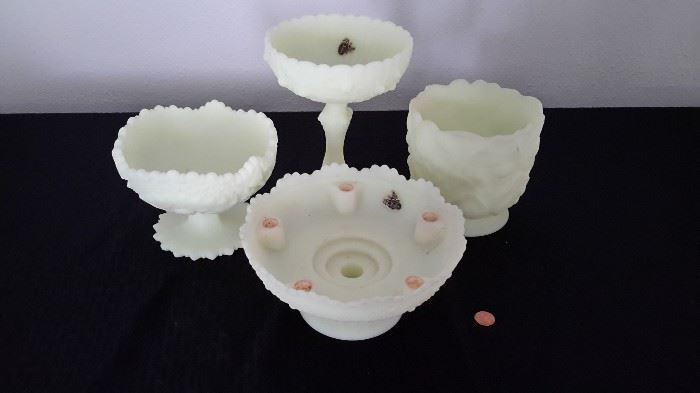 Vintage Fenton Custard footed dishes, one up front with candle holders.