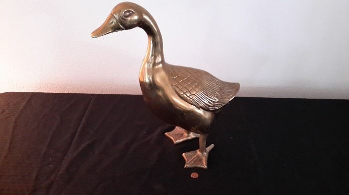 Hollow brass duck.