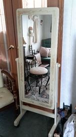 Lovely painted wood frame mirror with red velvet back and casters.