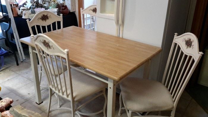 Laminate "butcher's block"-look small dining table and 4 metal chairs with white upholstered seats. One matching swivel barstool.