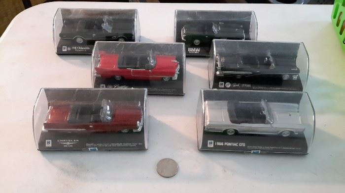 New-Ray Toys die cast cars, new in cases, never opened. 1966 Pontiac GTO, 1959 Chrysler 300E, 1956 BMW 507, 1966 Oldsmobile Cutlass 4-4-2, 1955 Cadillac Eldorado.