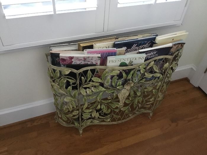 Classic wrought iron planter used as a magazine rack.  Great idea.