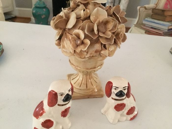 Pair of faux dogs with a pottery urn