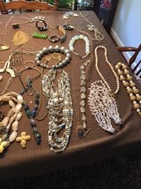 More necklaces. Only a partial glimpse of the size of this LARGE collection of designer costume jewelry.