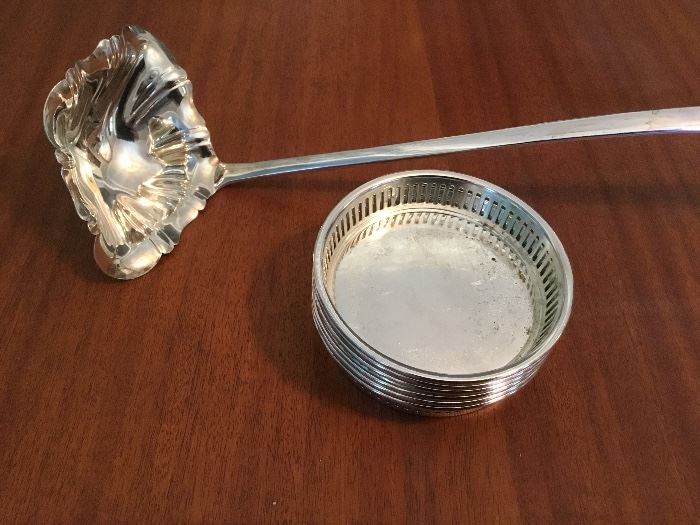 Silver plate ladle and sp coasters.