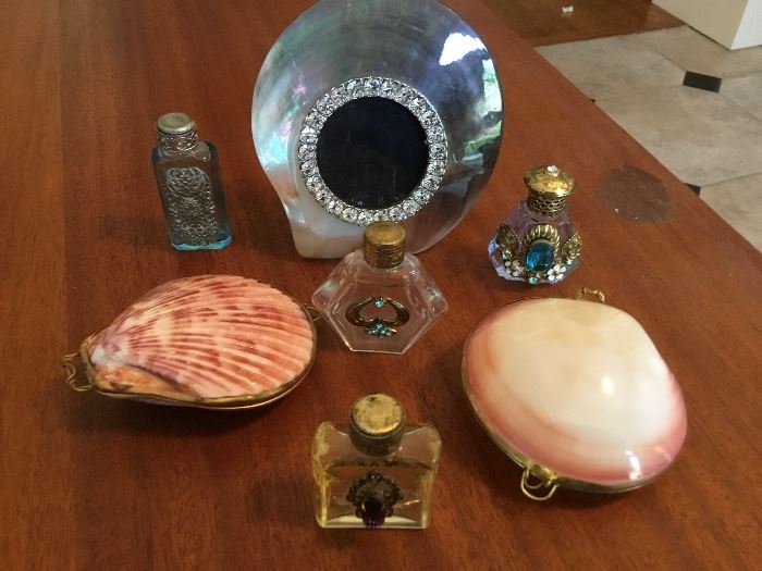 Shell purses, perfume bottles and a shell frame.