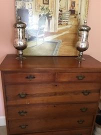 Antique chest with a pair of mercury glass jars.