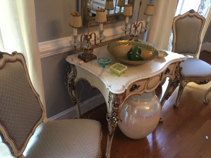 Marble top table and two of a set of six chairs.