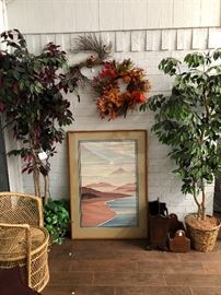 Wall art, artificial trees, wicker chair