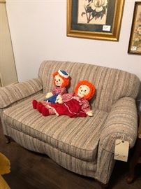 loveseat with raggedy Ann and Andy