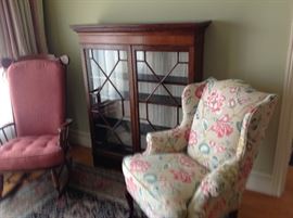 Floral wingchair and curio cabinet