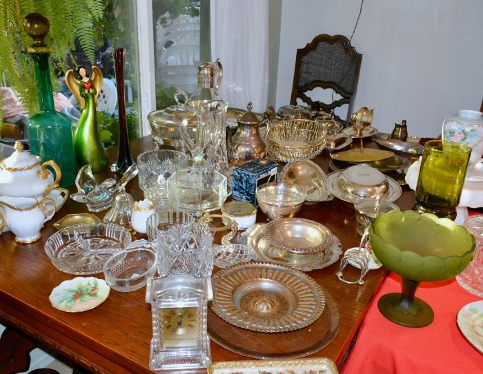 Table full of Silver Plate Serving items