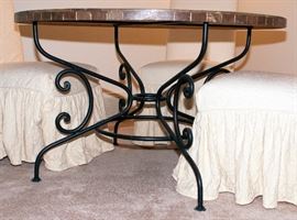 Arhaus marble table top with cast iron legs with four covered chairs - 48" Diameter x 30" Height. Cast iron leg detail.
