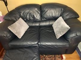 Deep blue leather loveseat
