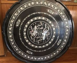 Lacquer and abalone inlaid table with 13 inch legs. 