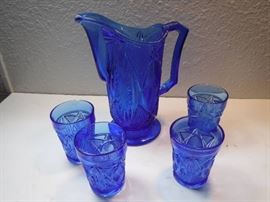 antique blue glass pitcher with glasses