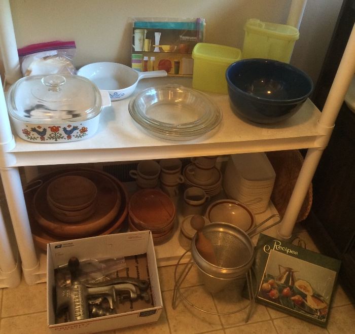 Corning Ware, Pyrex pie pans, blue mixing bowl, Tupperware, wooden salad bowls, canning sieve with stand