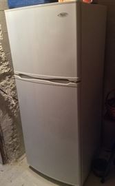 Apartment-size Whirlpool refrigerator/freezer. 10 cu. ft., 5 ft. tall. New in 2010, clean & works fine.