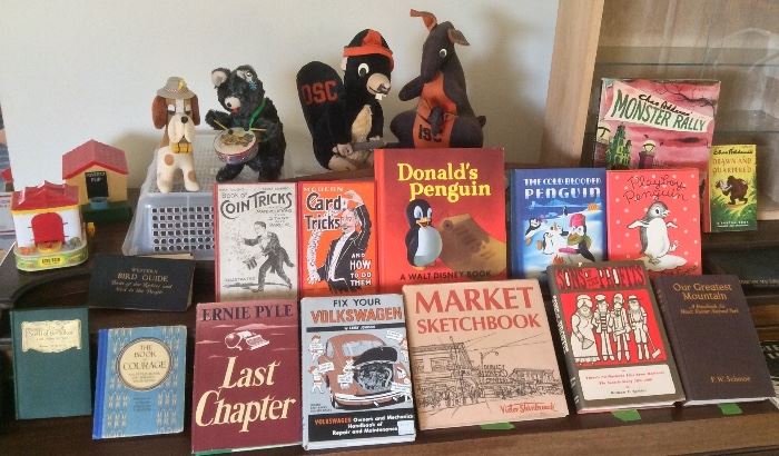 Coin operated banks, wind-up toys, vintage college mascot toys, a selection of the more interesting books - note penguin titles!